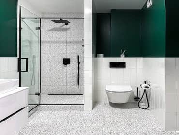 Modern Bathroom Remodel This modern bathroom renovation blends bold design with everyday functionality through a striking combination of terrazzo-insp