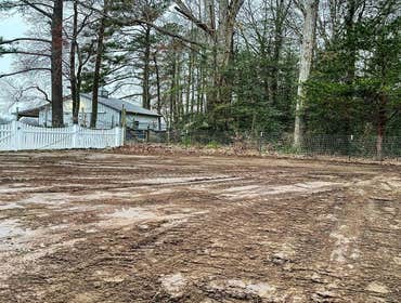 Photos by Apeiron Construction Group #1 Water drainage Improvements: ram 4” perforated ADS through this area and regraded so water flowed continuously 