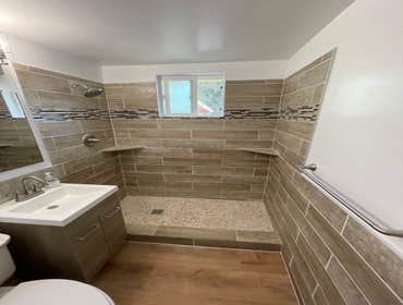 Photos by Triple A LLC #1 Complete bathroom remodel, removal of flooring and old shower and tub.