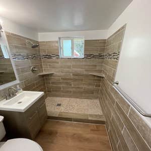 Photos by Triple A LLC #1 Complete bathroom remodel, removal of flooring and old shower and tub.