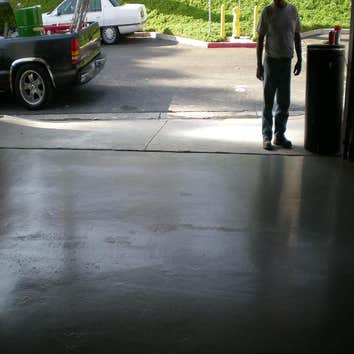Custom garage floor insalling a custom designed and colored floor in a high end restaraunt.