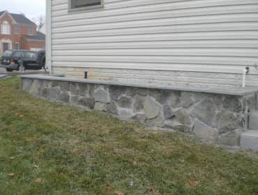 Paver Patio and Walkway This is a a combination of some of our work. Landscaping box and Veneer retaining wall, walkway and flagstone patio.