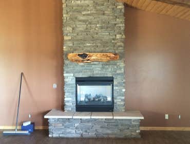 Stone fire place with mantel