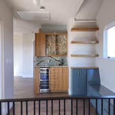 Custom Wet Bar Oak Cabinets & Floating Shelves