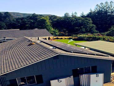 Installations Green Stock Solar ground-mounts and installations on comp, tile, and metal roofs!