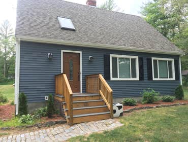 Vinyl Siding - Algonquin Way - E. Freetown Clapboard style vinyl siding in Harbor Blue with White trim and Black shutters.