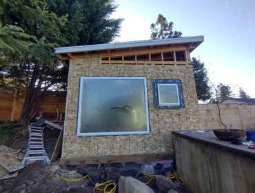 Photos by Stewart & Son Gate & Fence LLC #1 Tiny House with pergola. Small house 17' by 12' small bathroom with pocket door, and small sink with water 