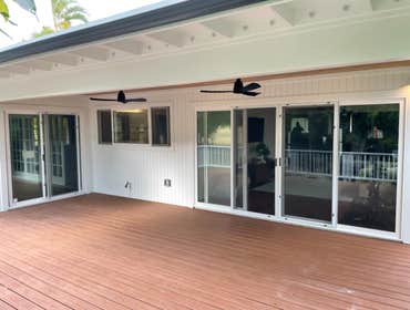 Kailua Addition and Bathroom Renovation New addition includes sitting room with 4 french sliding doors, new covered and extended lanai with Trex deckin