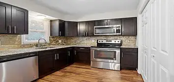 Photos by Swj Builders LLC #1 This full home renovation included a complete kitchen and bathroom remodel, new flooring throughout the house, interior p
