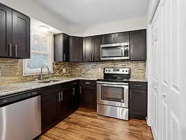 Photos by Swj Builders LLC #1 This full home renovation included a complete kitchen and bathroom remodel, new flooring throughout the house, interior p