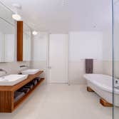 TRIBECA TRIPLEX PENTHOUSE RENOVATION Renovation of three floor loft space with new staircases, kitchen, living quarters, bathrooms and rooftop kitchen/