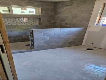 Large walk in shower with many details! This project and budget consisted of rough materials and installation only. The cost of tile is not included.