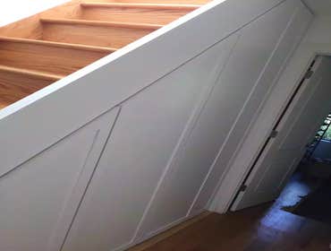 Custom closet under the stairs