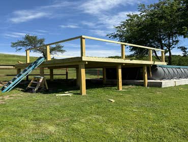 Photos by Fjm Remodeling #1 Above pool 16x16 deck