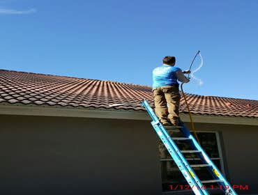 Photos from Popa Construction LLC Before & Afters of a soft wash roof cleaning and driveway and side walk cleaning.
