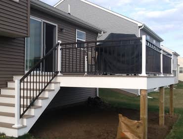 Photos by Custom Home Specialties Inc #2 Timber Tech maintenance free decks with powder coated railings.