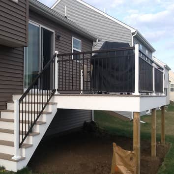 Photos by Custom Home Specialties Inc #2 Timber Tech maintenance free decks with powder coated railings.