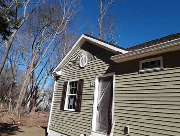 Photos by Better Home Improvement #9 Vinyl siding w/ custom made sun burst