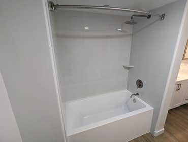 Apartment Renovation Unit Renovation including electrical and plumbing upgrades, tub replacement, new cabinets and counters, new flooring, full paint, 