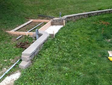 Retaining wall and outdoor lighting