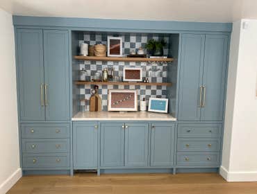 Photos by Optimum Construction Group Inc. #4 This custom living room vanity is thoughtfully designed to combine elegant style with practical book stora