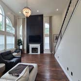 Photos by Construction Bros LLC #1 Accent wall installed to living room wall, boasting 18 foot ceilings. Modern, sleek, and a stunning focal point.