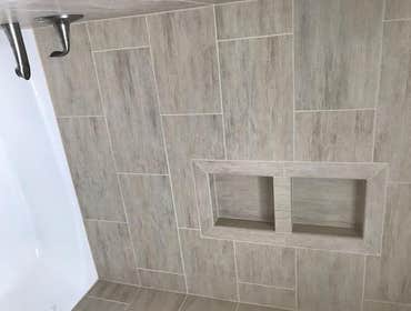 Multiple Rooms in Princeton Junction, New Jersey We completed multiple bathrooms in Princeton Junction featuring this lovely two sided glass shower wal