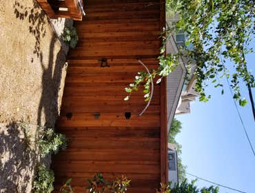 Curved gate Cedar Board on Board Cap and Trim