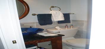 New Hope bathroom Made bathroom bigger, installed pocket door, built in cabinet, custom vanity, wall faucet, water closet, floor and wall tile, exaust 