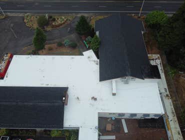 Isaac Roof Construction Commercial Roof Project Flat roof replacement with a minimum R-value of R-30 and a Class A Fire rating.