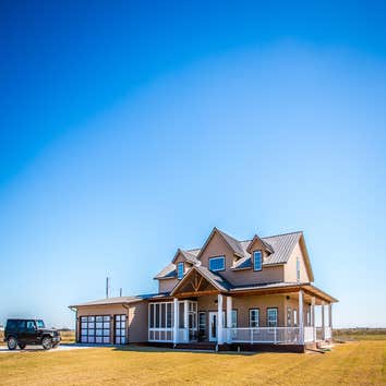 Ranch Road Ranch Road is a design that originated on an open rural site. Located west of Calumet, Oklahoma the site is situated next to a lake with a s