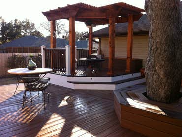 Custom composite deck with cedar arbor, amenities Custom Trex deck, multi level, with raised cedar arbor dining area, three cedar side planter boxes, b