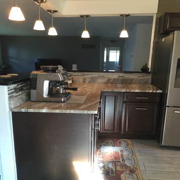 Photos by Head to Toe Home Improvement #1 entirely remodeling an old kitchen to include updated cabinets, back splash, breakfast bar, lights, and floor