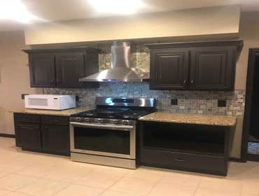 Sun Room Addition & Kitchen Remodel Added sun room to existing porch. Renovated kitchen to include new backsplash, range hood vent and installation of 