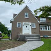 Southampton Front Porch Added a roof to an existing front porch to provide some weather protection and curb appeal