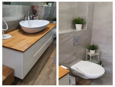 Photos by Tulip Remodeling #7 This modern bathroom features a beautiful floating vanity with white cabinets, and hardwood countertop and basin sink. th