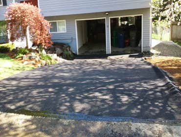 Issaquah Asphalt Driveway w/Channel Drain Asphalt Driveway Removal and Replacement w/ installation of 16' of concrete channel drain w/ cast iron grate