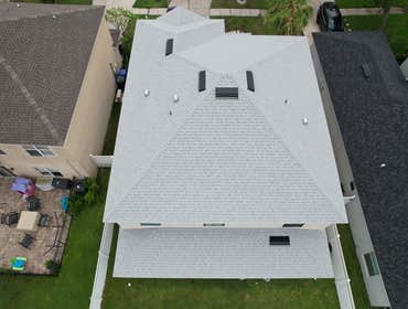 Photos by WOODSTONE ROOFING