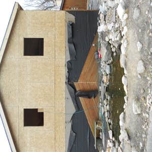 Photos by Innovative Masonry Restoration and Concrete #1 New stone work and cedar planking with pond
