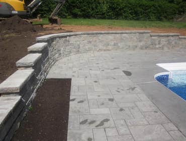 Photos by Dunn Landscape Construction #1 After initial pool installation provide all hardscape including retaining walls, pool deck, walkways and plant