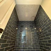 Photos by Purflo plumbing LLC #1 Custom 3’x5 subway tiled shower with mitered joints