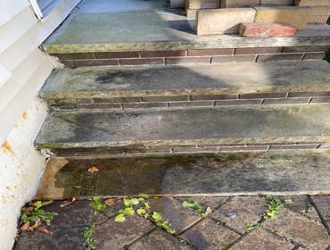Pressure washing paving stones and stone steps Power washed stone steps and paving stones front of house