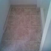 Tile & Hardwood In this project the customer went with a product called Duraceramic. Toilets were removed and reinstalled in both bathrooms. Downstairs