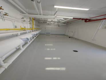 Photos by Surface Protective Coatings #2 resinous flooring on laundry room and painting the conduits to req. color code.