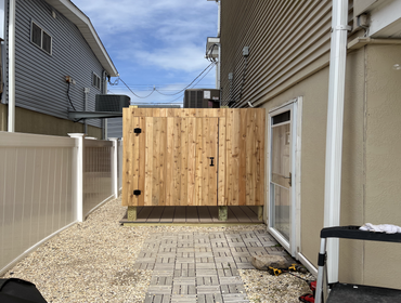 Photos by Mjf Carpentry LLC #1 Beautiful out door shower. All natural cedar walls, door and shelves with treated framing. Decking is Azak with a hidden