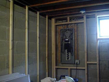 Project 1, building a basement with a powder room, Project 2, restoration of ceder shingles & shutters Framing over concrete, installing electric ligh