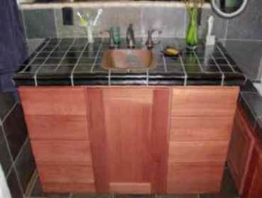 Glass tiles for countertop with hammered copper sink
