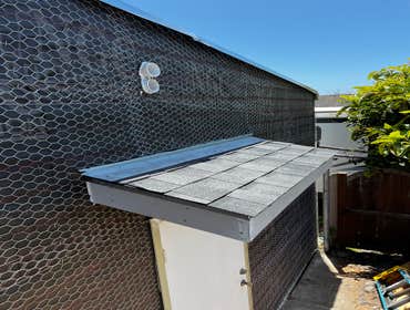 Photos by Santiago's Bay Builders Inc #1 Remodeling half of the building