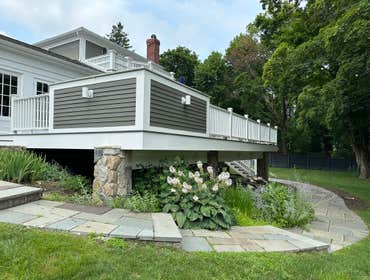 Photos by Kyle Matthew Construction #1 New rear composite deck with an outdoor kitchen.