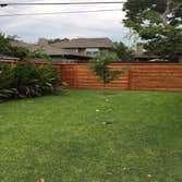 Horizontal Fence 186 ln ft. 2x6 rot board, 2x6 cedar top cap, metal post, pecan stain,